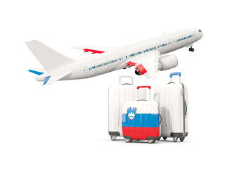 Luggage with flag of slovenia. Three bags with airplane
