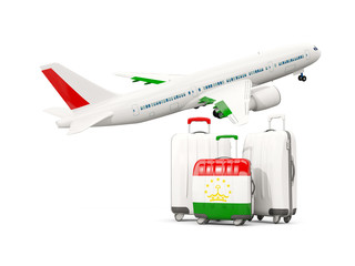 Luggage with flag of tajikistan. Three bags with airplane