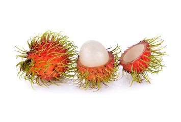 whole and peeled fresh rambutan on white background