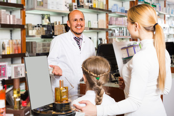 Fototapeta na wymiar pharmacist standing with a cash desk