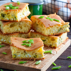 Sliced pie with onions and eggs, square