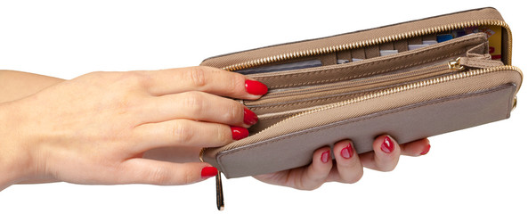 women's hands holding leather wallet