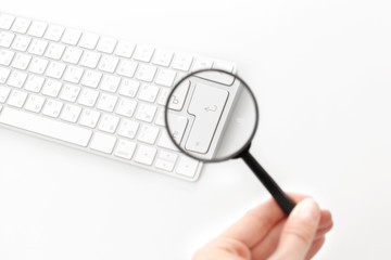 Laptop with a magnifying glass