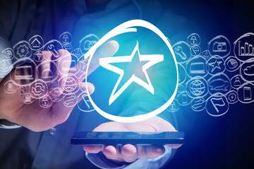 Star icon going out a smartphone interface - technology concept