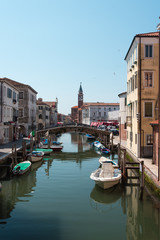 Reflections along the canals of Chioggia, Venice and its lagoon.