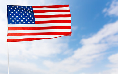American flag against blue sky