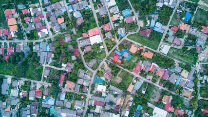 Aerial view of residential houses and driveways.