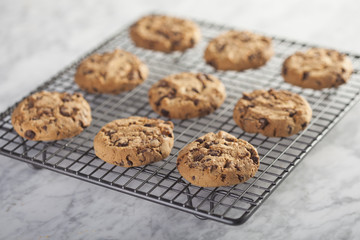 Cookies on a cooling rack over a marble table