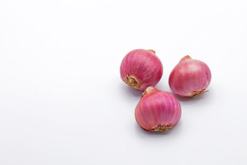 Three Red Onions on White Background