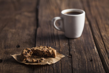 Coffee cup and Cookies on wooden table
