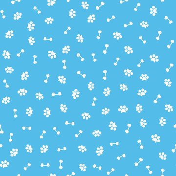 The imprint of dog paws and bones. Seamless pattern.