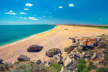Panoramic view of Pink lake and the sea. Deserted beach