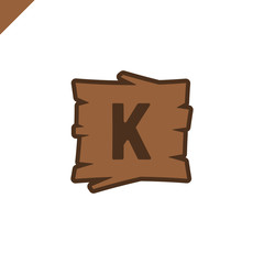 Wooden alphabet or font blocks with letter k in wood texture area with outline.