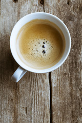 Delicious coffee cup on wooden background
