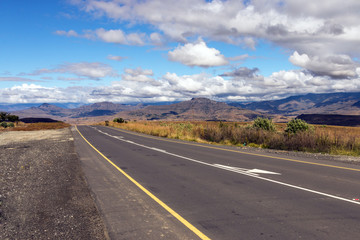 Asphalt Road Running Through Dry Orange Winter Mountain Landscape