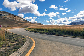 Asphalt Road Running Through Dry Orange Winter Mountain Landscape