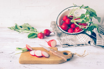 Fresh radishes sliced on the kitchen table