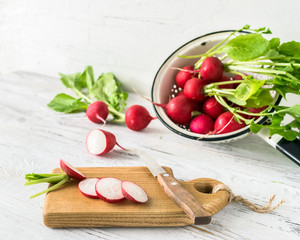 Fresh radishes sliced on the kitchen table