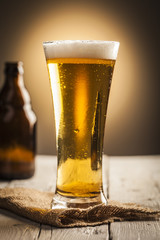 Glass of beer and bottle