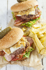     Deluxe gourmet burger on wooden table 