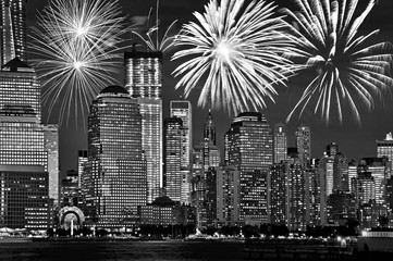 New York Manhattan skyline at night, with fireworks, american US celebration and party, black and...