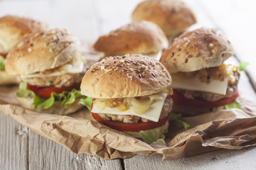 Deluxe gourmet burger on wooden table