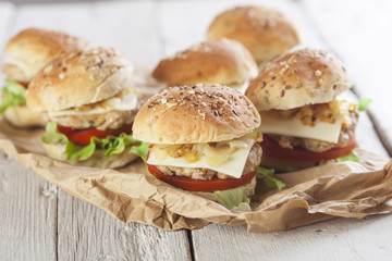     Deluxe gourmet burger on wooden table 