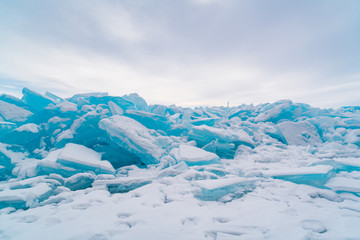 Ice blocks covered with snow in Lake Baikal