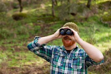 Young Man using binoculars