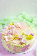 Fototapeta na wymiar Colorful bright cake with flowers