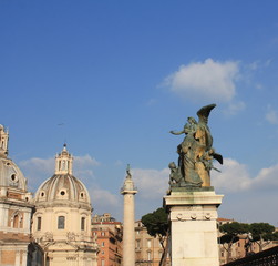 Fototapeta na wymiar Santa Maria di Loreto church and statue in front of National Monument of Victor Emmanuel II, Rome, Italy