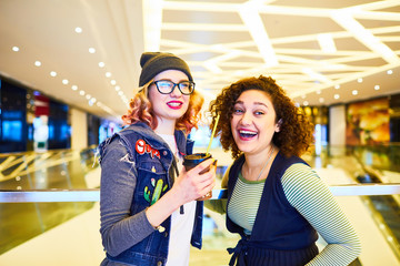 Two girls in shopping center