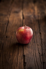 Red apples on wooden background
