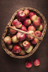 Red apples on wooden background