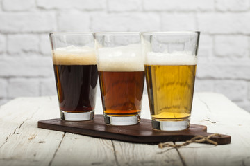 Assorted beers in a flight ready for tasting