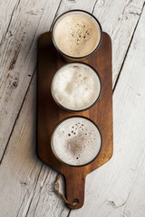 Assorted beers in a flight ready for tasting