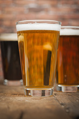 Three glasses with differet beers