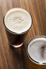 Glass of beer on wooden background