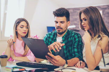 Web designers working together at modern office