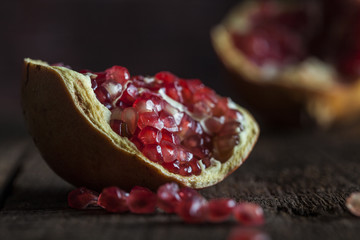 Pomegranate on a dark wooden background