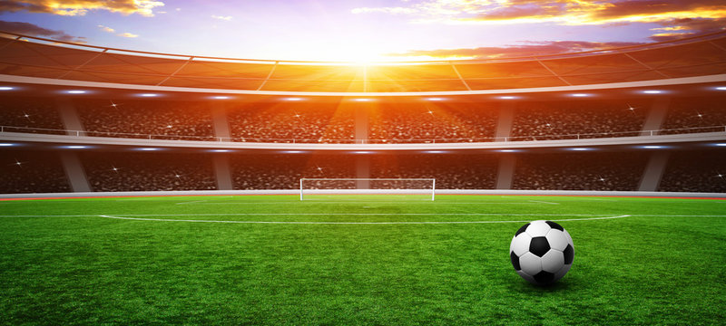 Soccer ball on green stadium