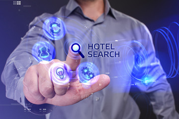 Business, Technology, Internet and network concept. Young businessman working on a virtual screen of the future and sees the inscription: Hotel search