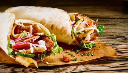 Tasty doner kebab with fresh salad trimmings - obrazy, fototapety, plakaty