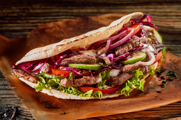 Delicious Asian doner kebab on toasted tortilla