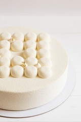 Fototapeta na wymiar White wedding cake on white background