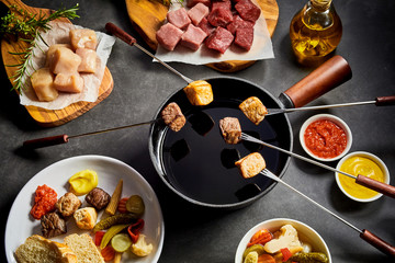 Delicious winter fondue with assorted meat