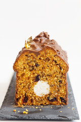Cut carrot cake with nuts and cranberries