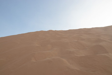 Fototapeta na wymiar closeup of sand pattern of a beach in the summer.