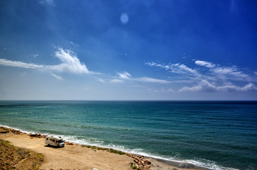Camping on the beach with a caravan, freedom concept