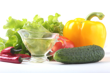 Assorted vegetables, fresh bell pepper, tomato, chilli pepper, cucumber, olive oil and lettuce isolated on white background. Selective focus.